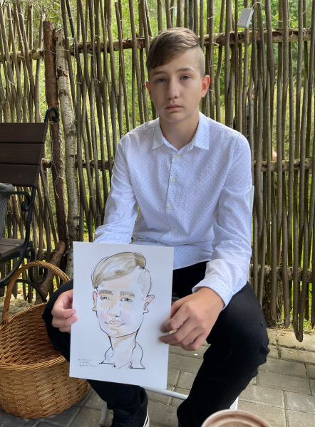 Юноша с шаржем в 